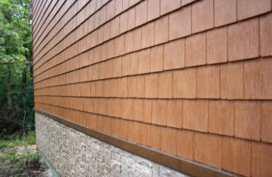 Сайдинг для отделки фасада дома коричневого оттенка